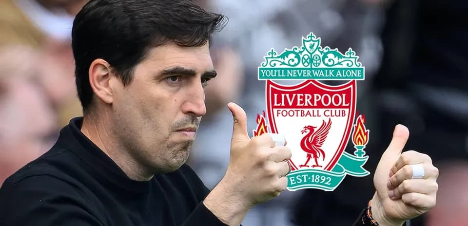 Coach giving thumbs up with Liverpool logo background