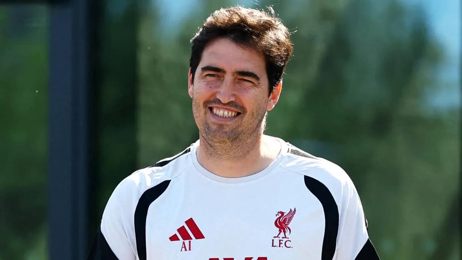 Coaching staff member smiling during training session
