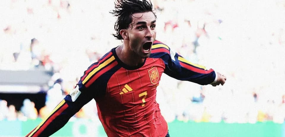 Player celebrating after scoring for Spain