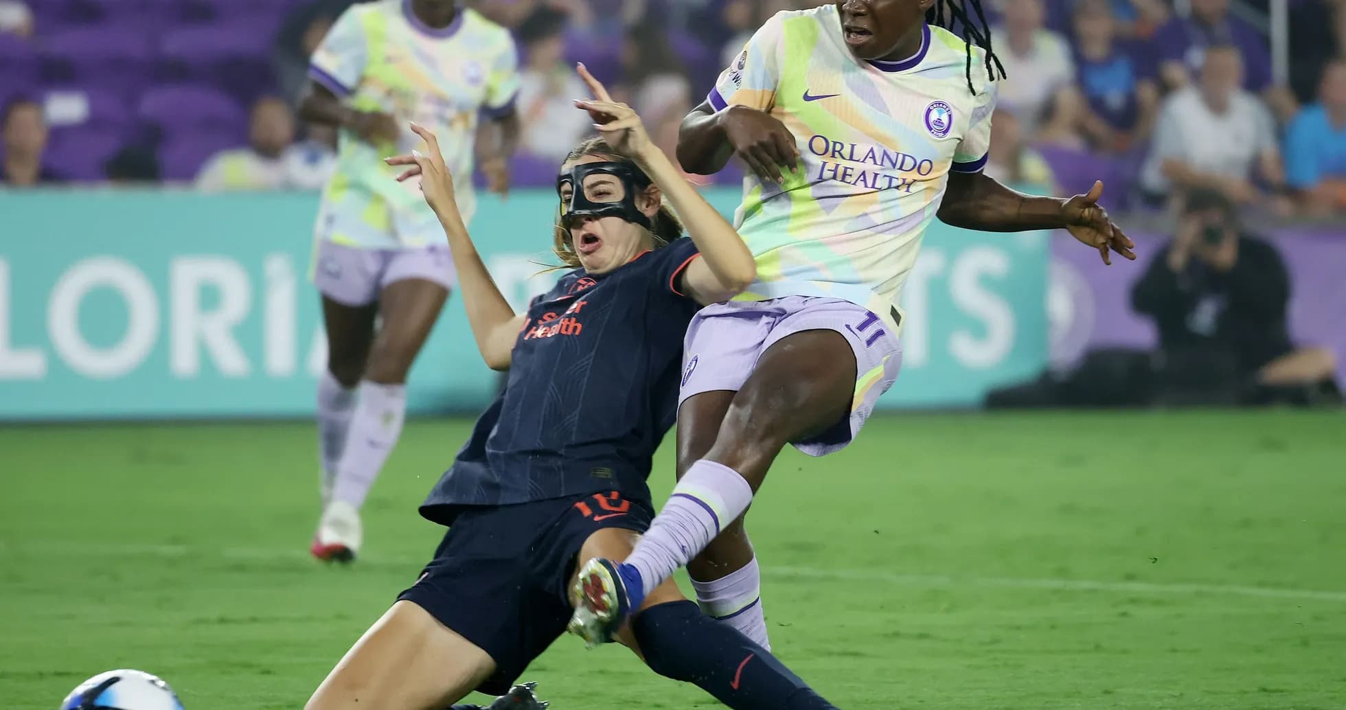 Bay FC W player tackling Orlando Pride W player