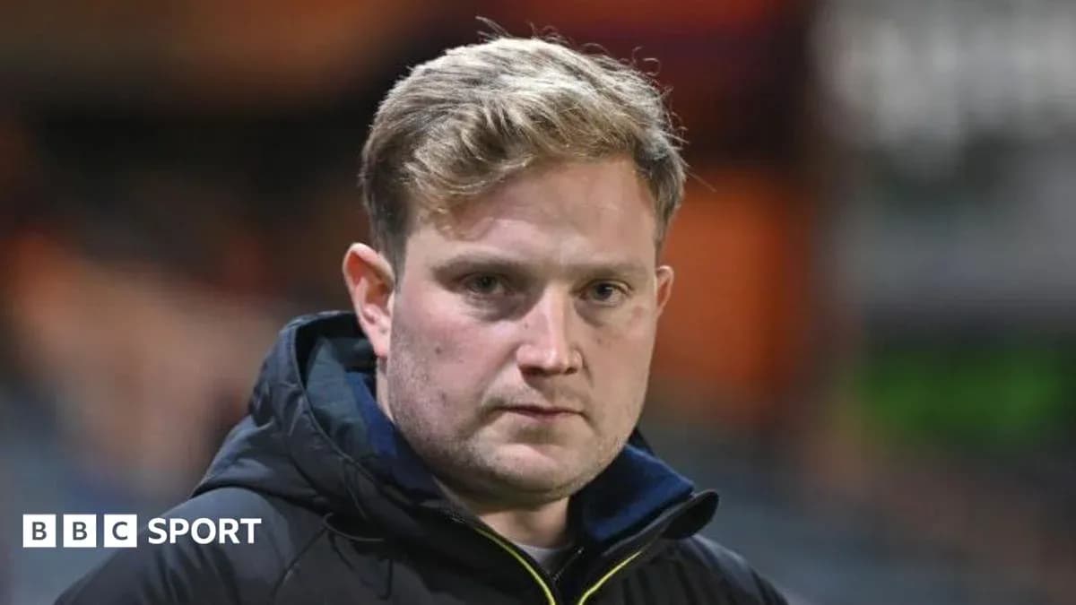 Coach looking directly at the camera during match
