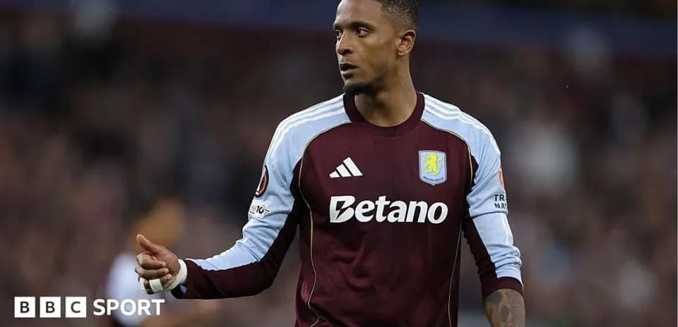 Player in Aston Villa kit during match action