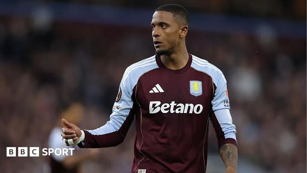 Player in Aston Villa kit during match action