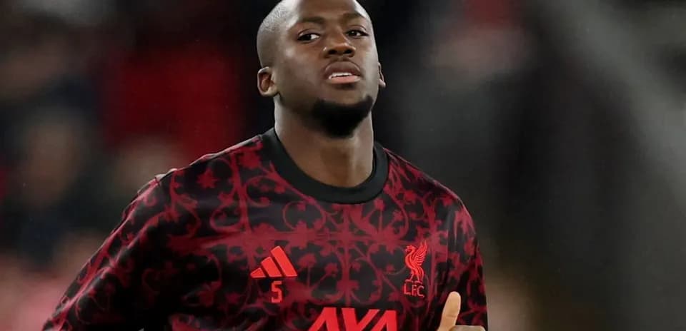Player in Liverpool kit warming up before match