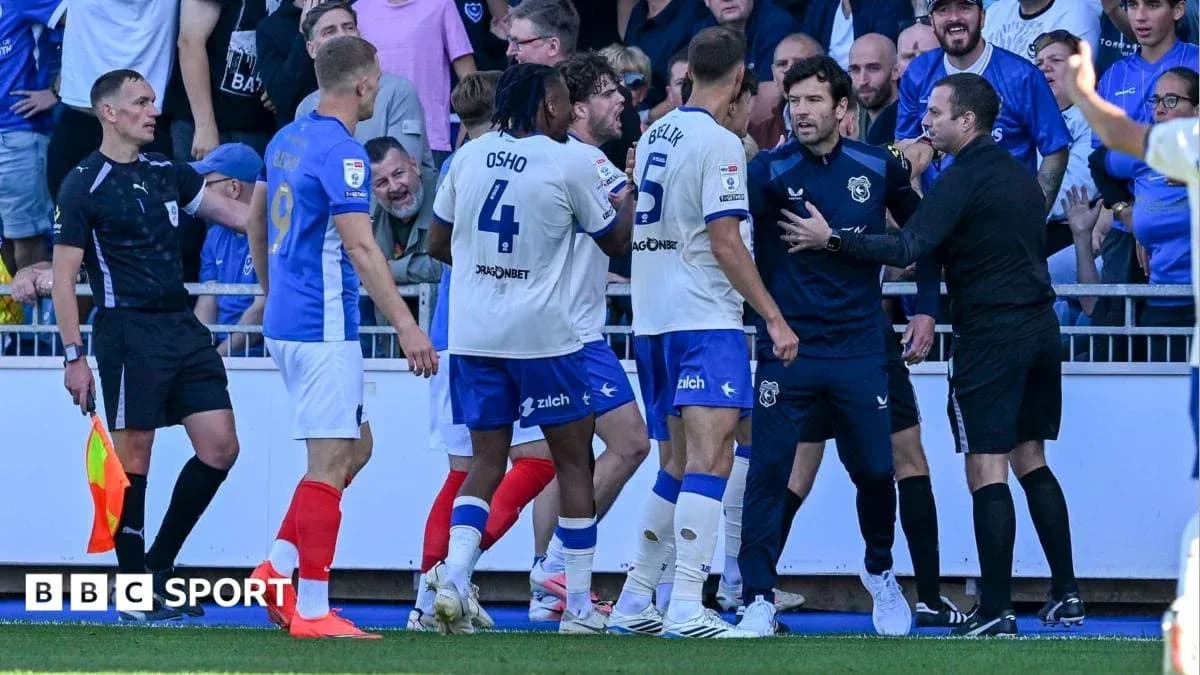 Players and referee involved in heated discussion during match