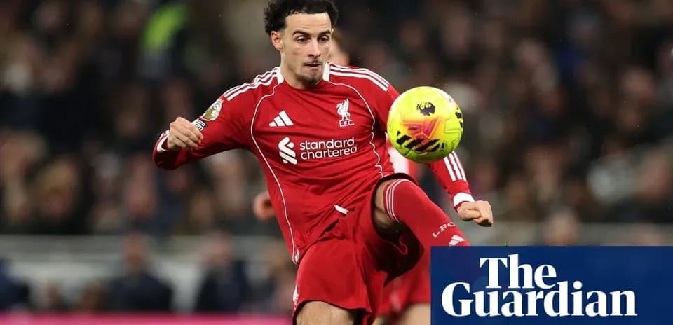 Liverpool player controlling the ball during match