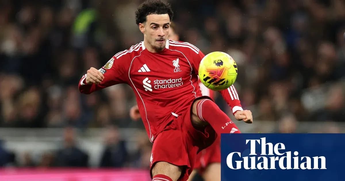 Liverpool player controlling the ball during match