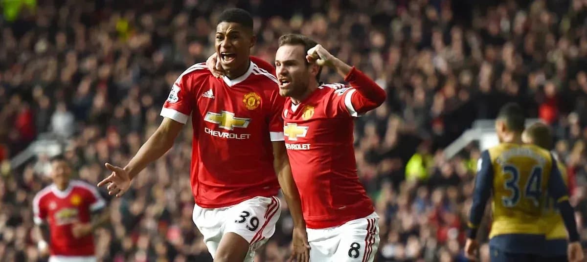 Manchester United players celebrating a goal together