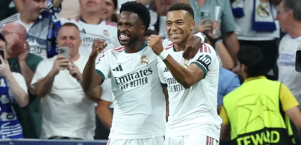 Two Real Madrid players celebrating a goal