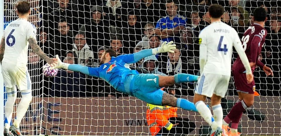 Goalkeeper saving a shot during match