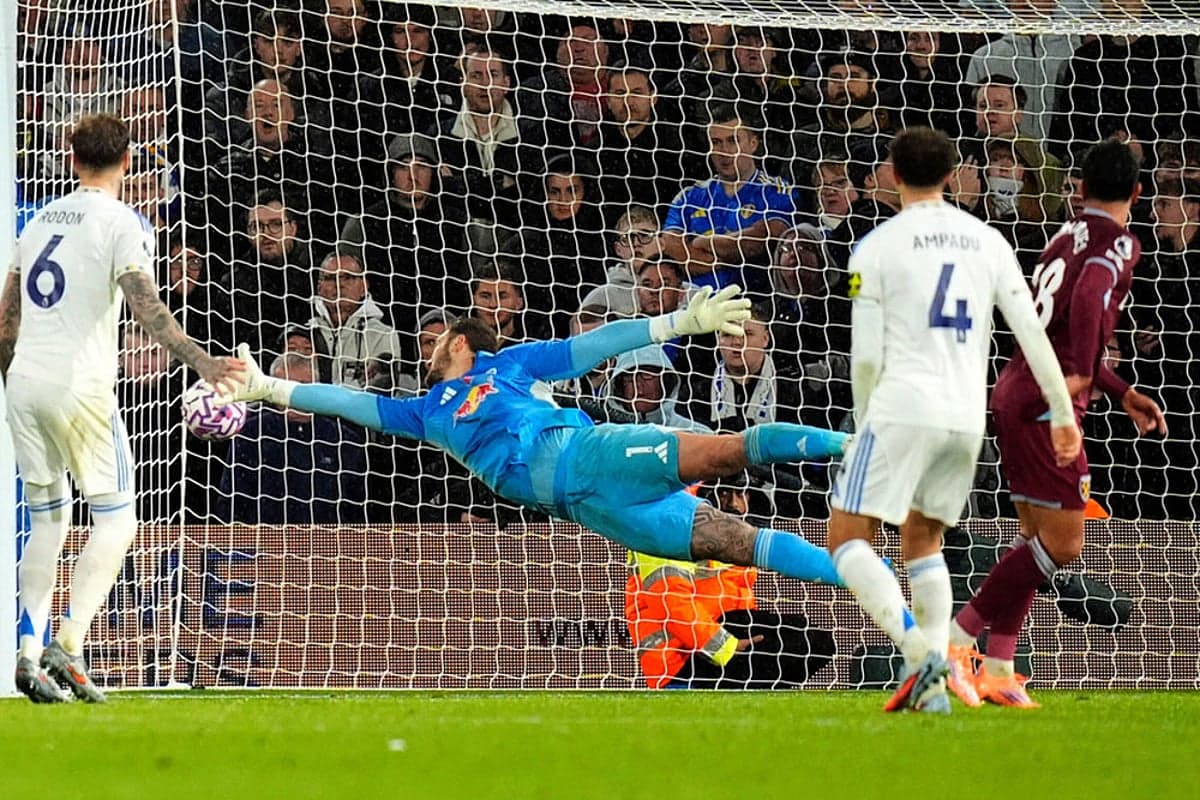 Goalkeeper saving a shot during match