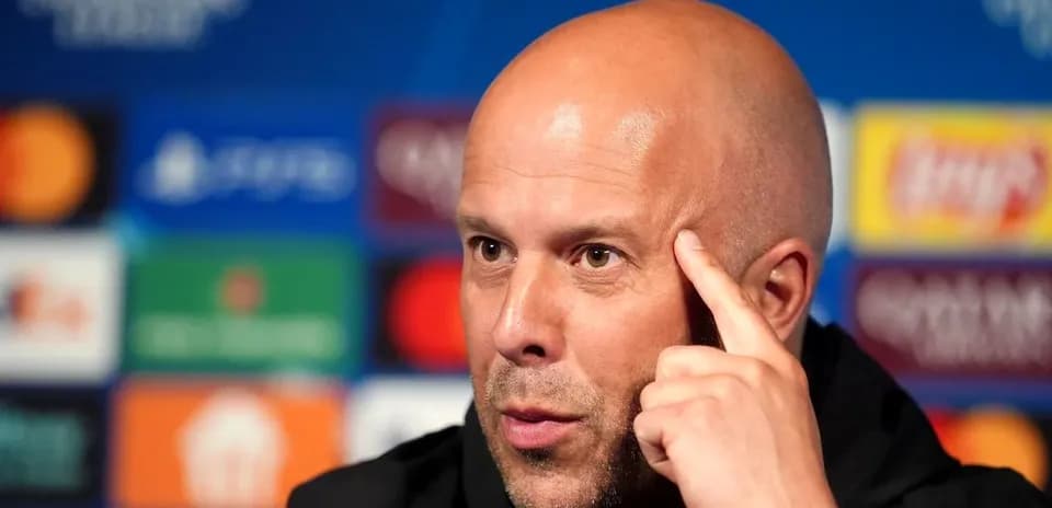 Manager speaking at press conference with UEFA backdrop