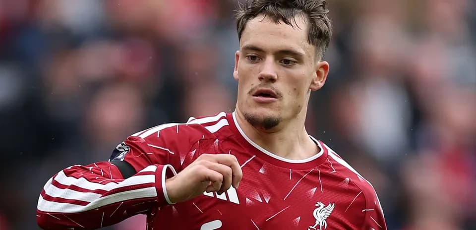 Player in Liverpool kit gestures during match