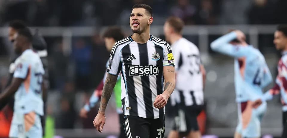 Newcastle player walking off the pitch after match