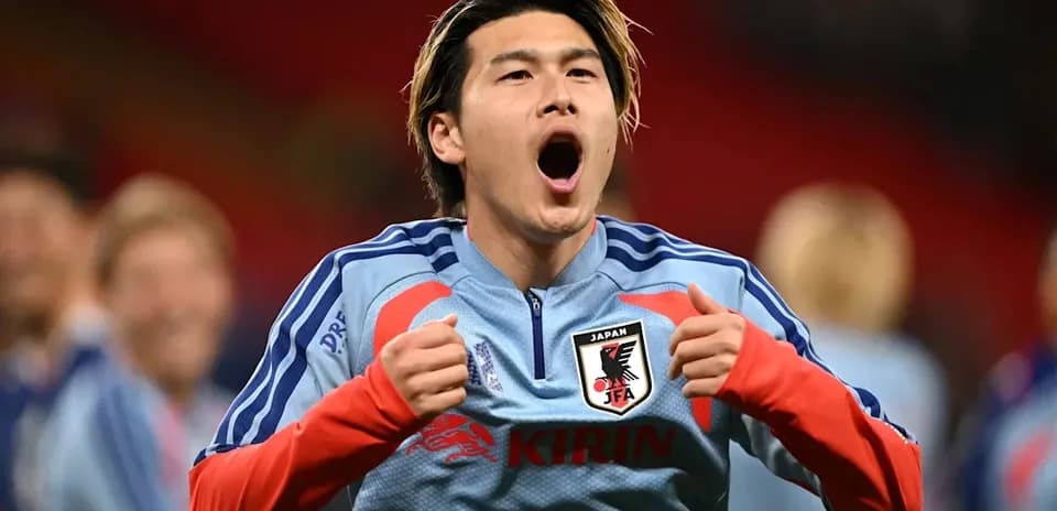 Player celebrating in Japan national team jersey