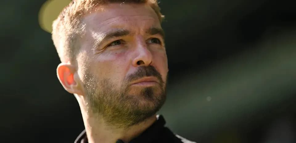Close-up of a man with short hair and beard