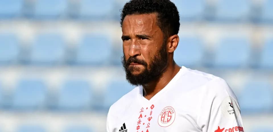 Player in white jersey during match at stadium