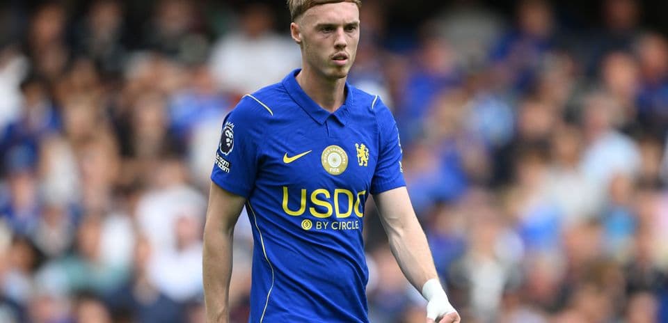 Player in blue Chelsea kit on the pitch