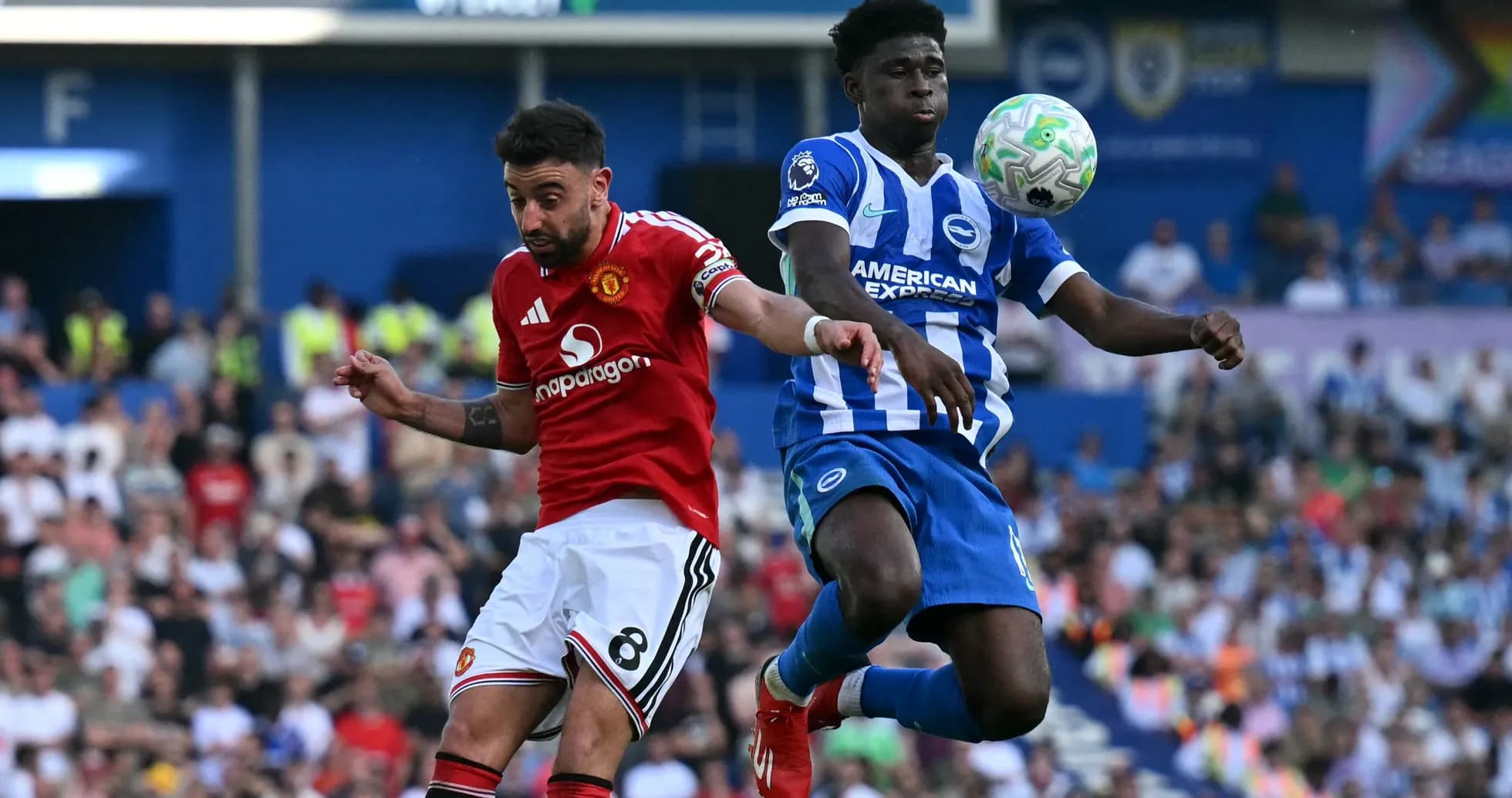 Bruno Fernandes and Brighton player contesting the ball
