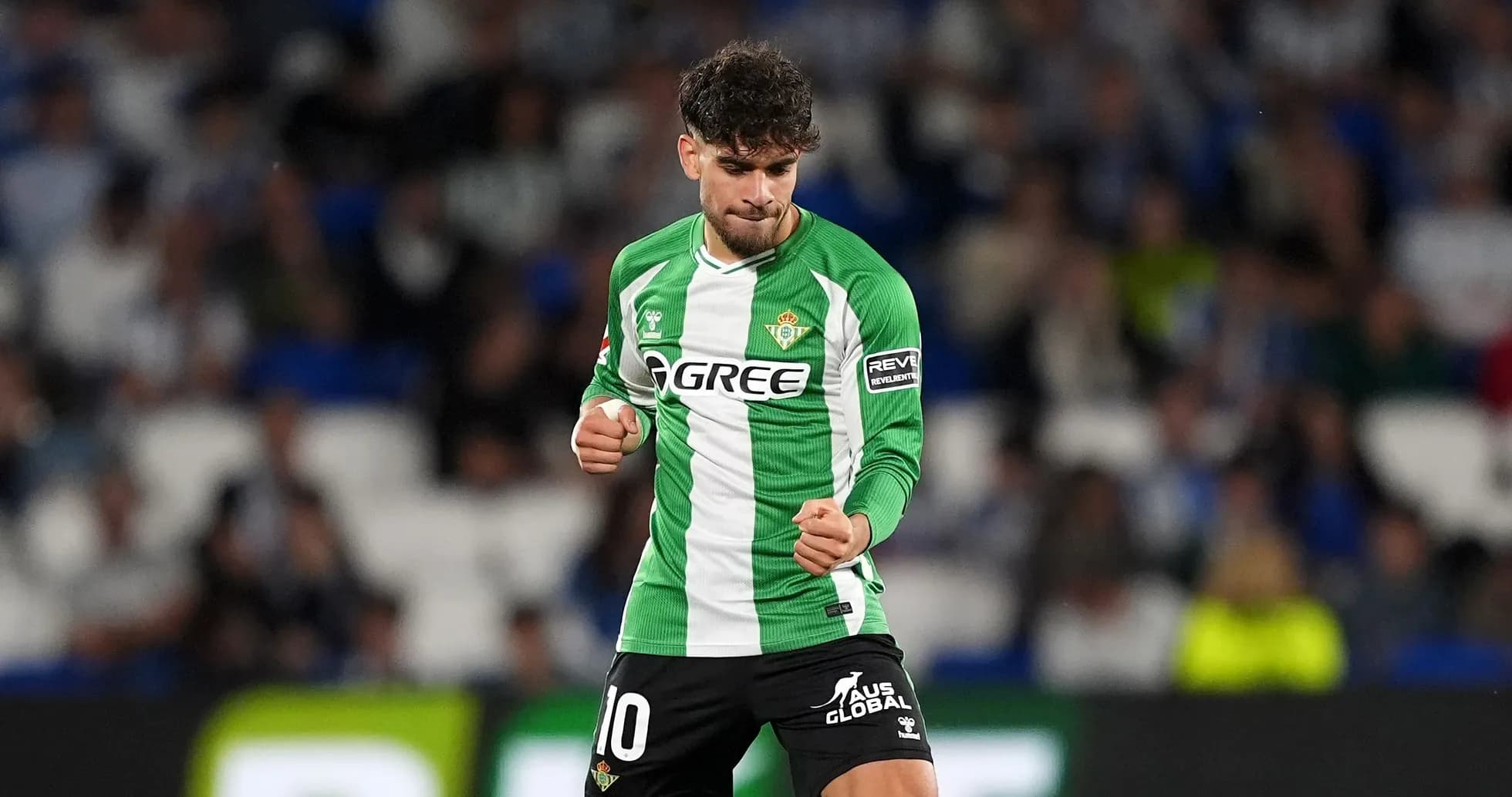 Player celebrating in Real Betis green jersey