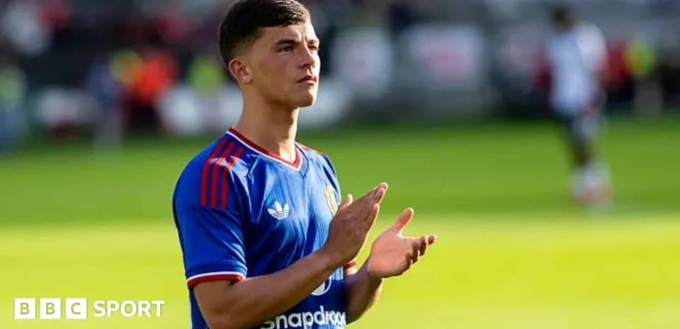 Player applauding fans on the pitch