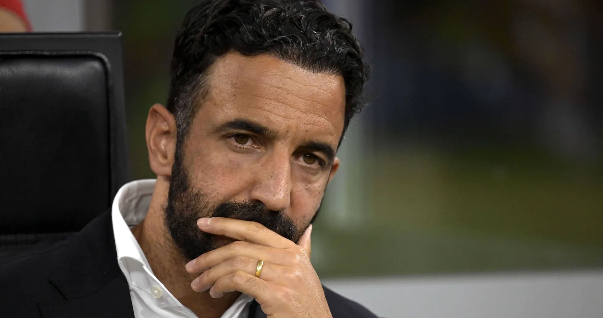 Coach deep in thought during a match