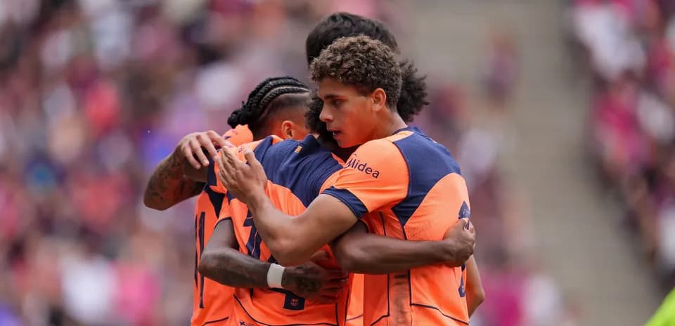 Players celebrating together during a match