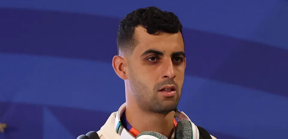 Player wearing headphones during event arrival