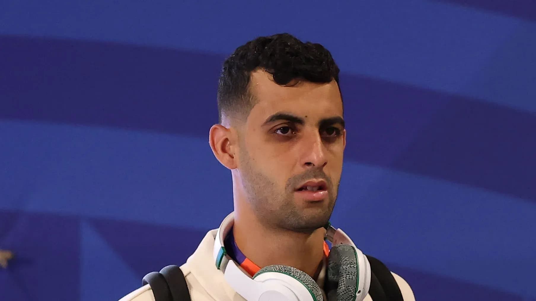 Player wearing headphones during event arrival
