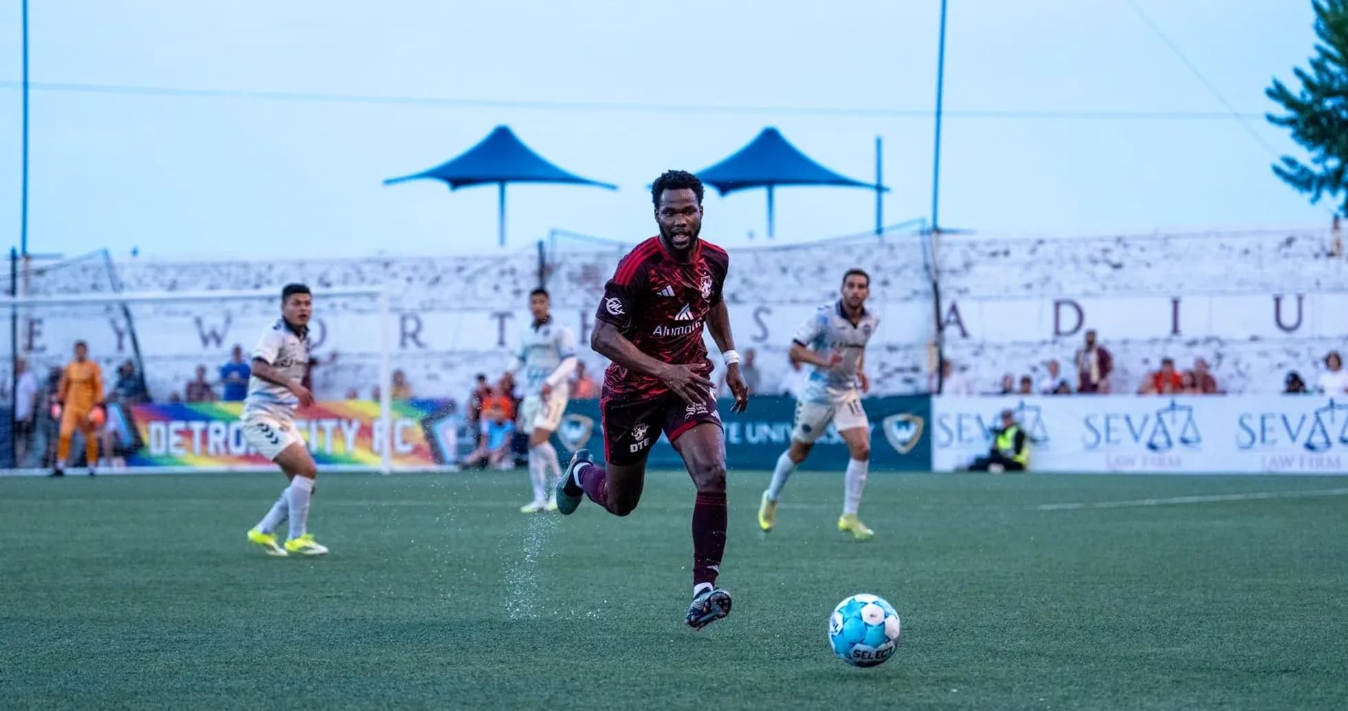 Detroit City player chasing the ball during match