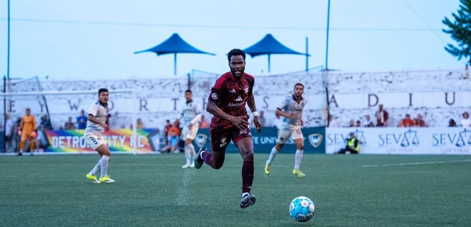 Detroit City player chasing the ball during match