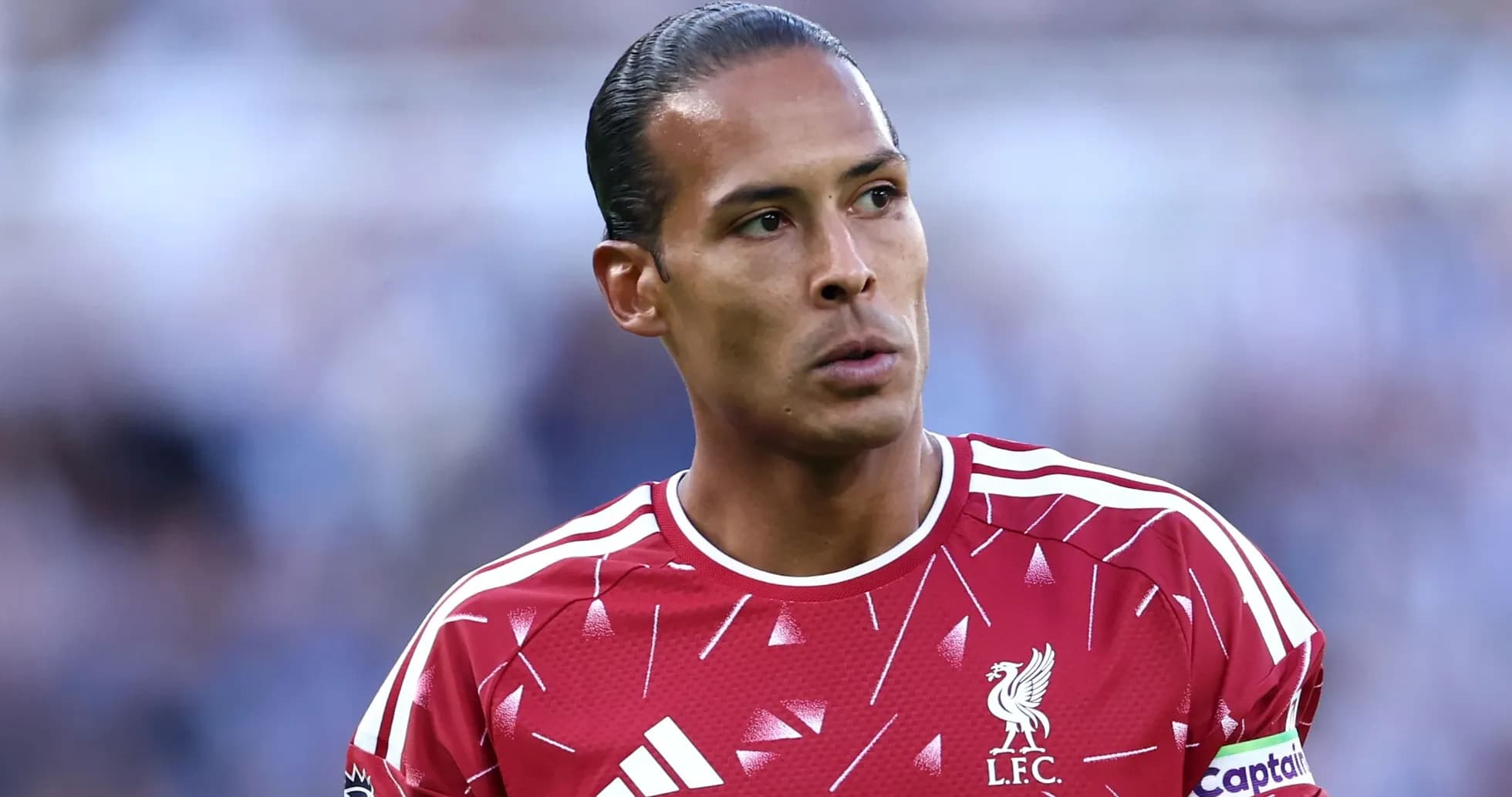 Player in Liverpool kit during match warm-up