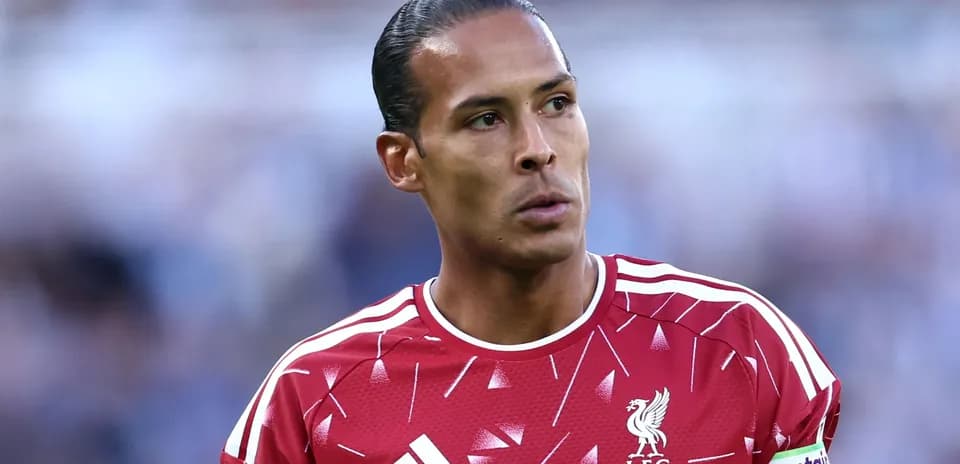 Player in Liverpool kit during match warm-up