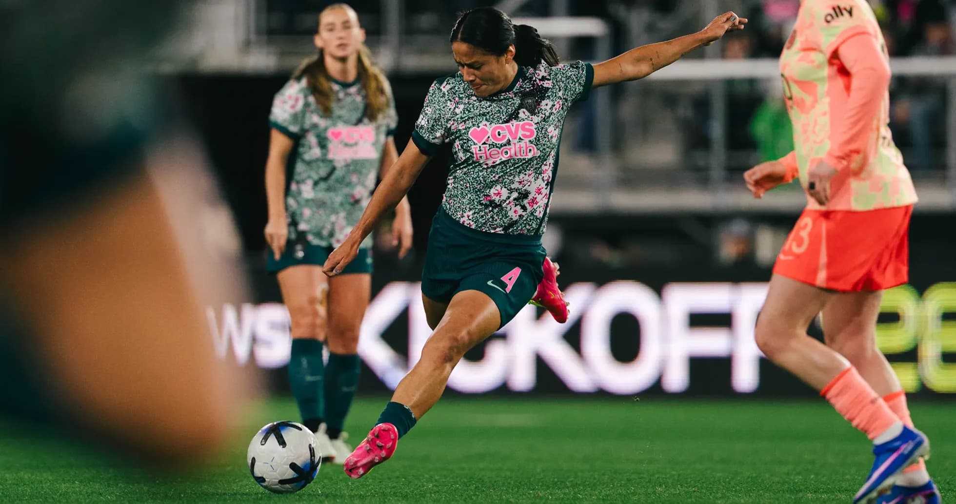 Player taking a kick during NWSL match