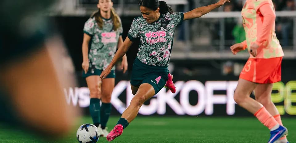 Player taking a kick during NWSL match
