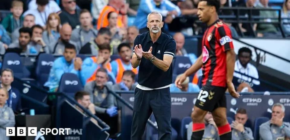 Manager directing player on the sidelines during match