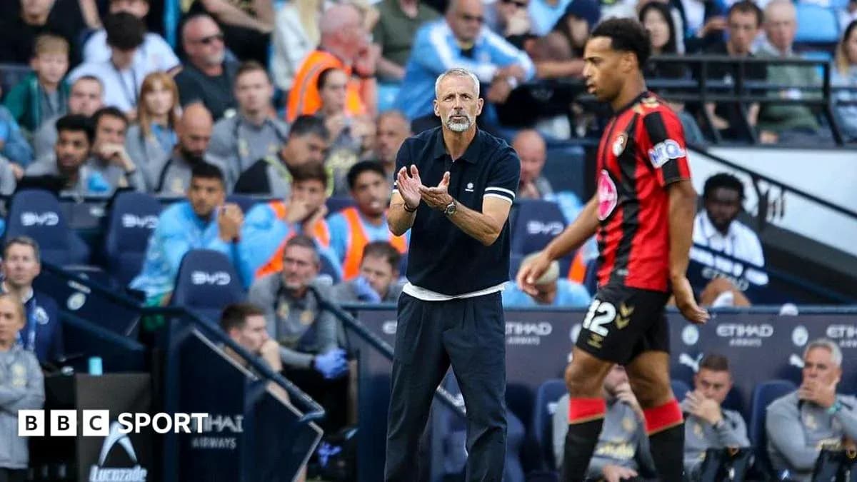Manager directing player on the sidelines during match