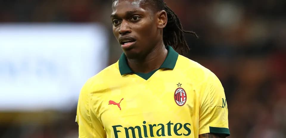 Player in yellow AC Milan jersey during match
