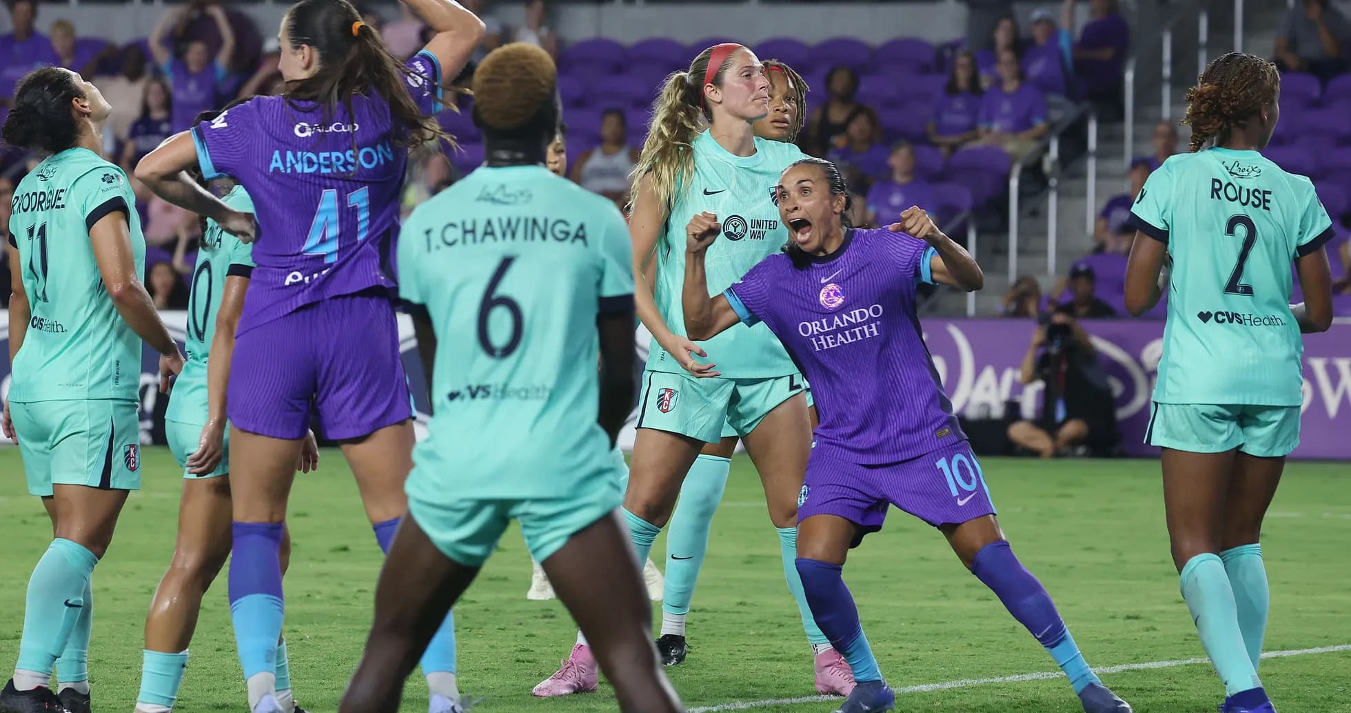 Orlando Pride players celebrating during match