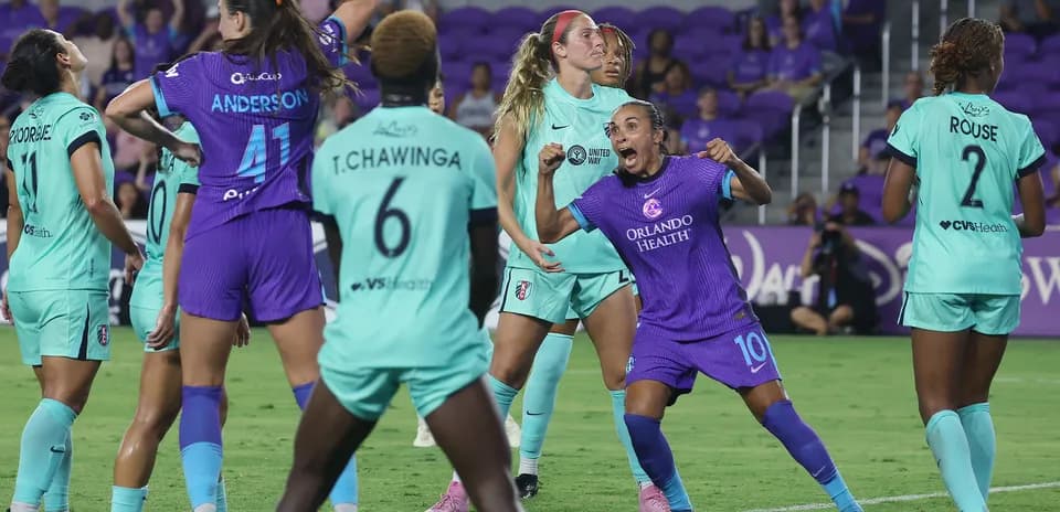 Orlando Pride players celebrating during match