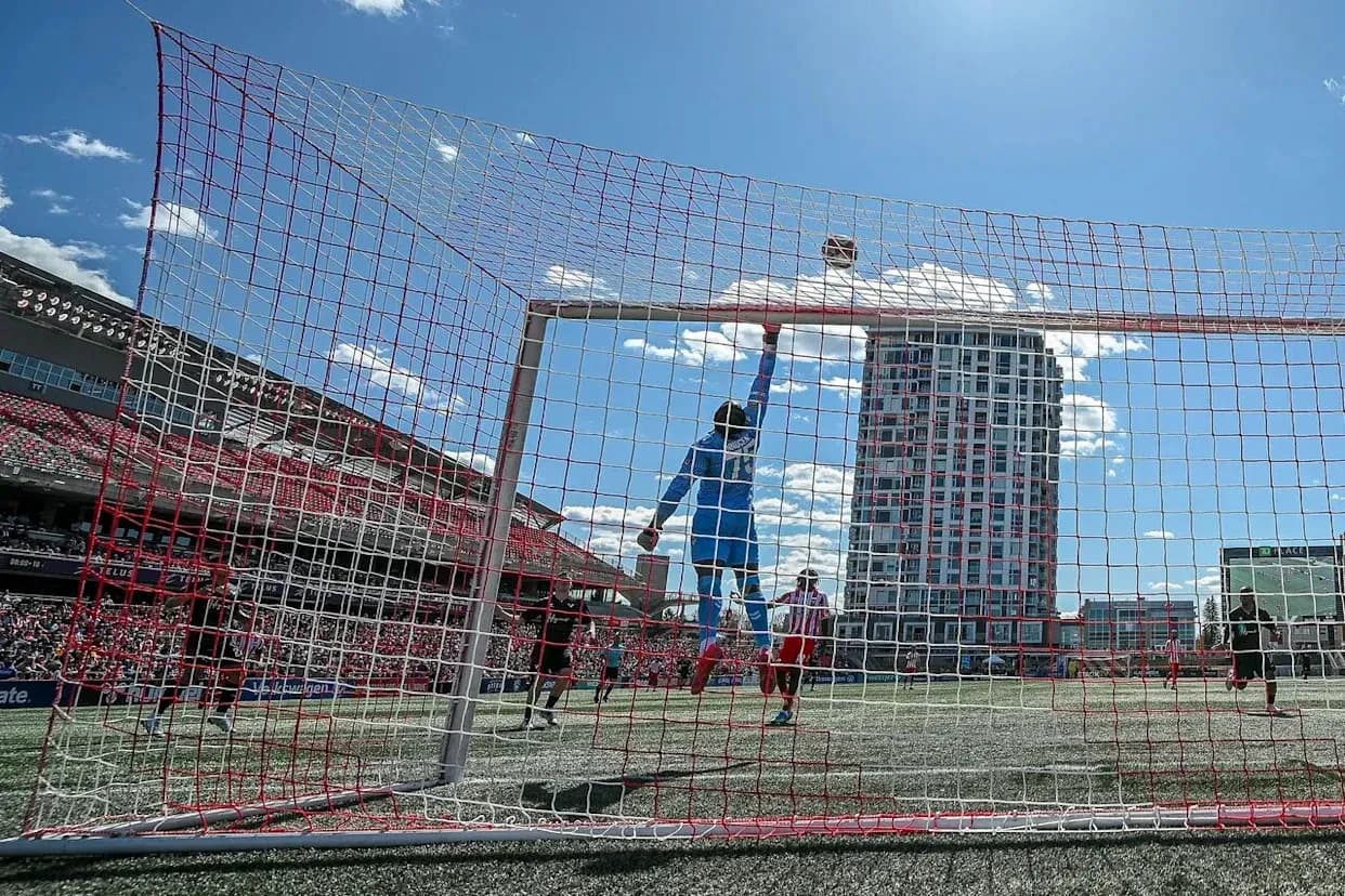 Goalkeeper jumping to save the ball