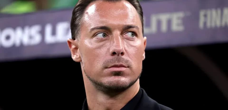 Man in black suit at Champions League final