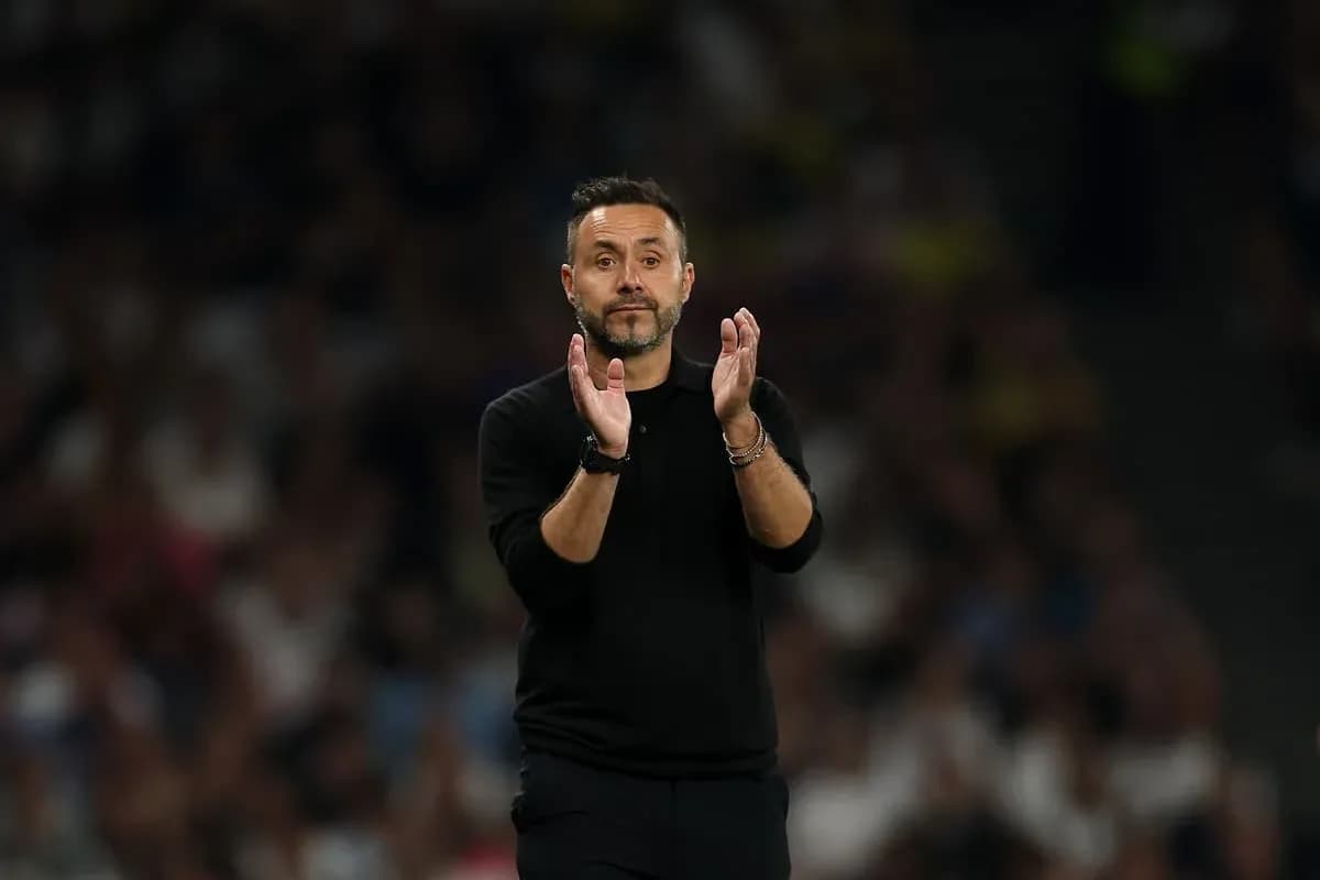 Manager applauding during a football match