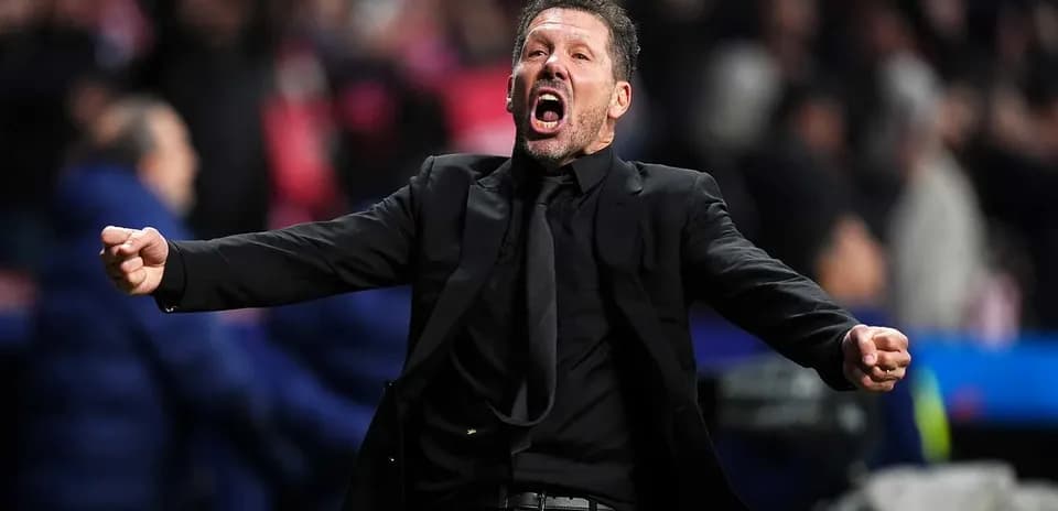 Coach celebrating passionately on the sideline