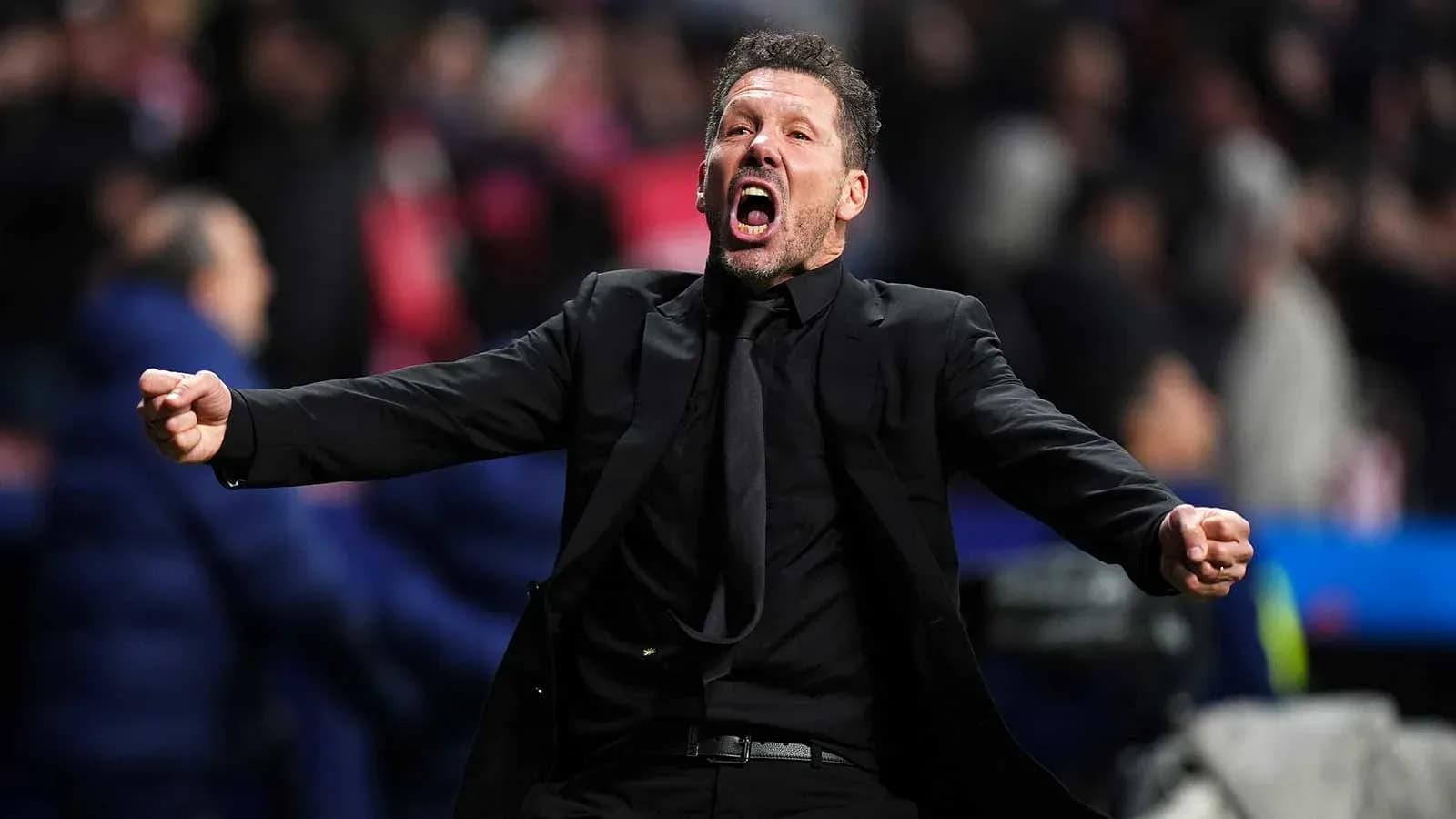 Coach celebrating passionately on the sideline