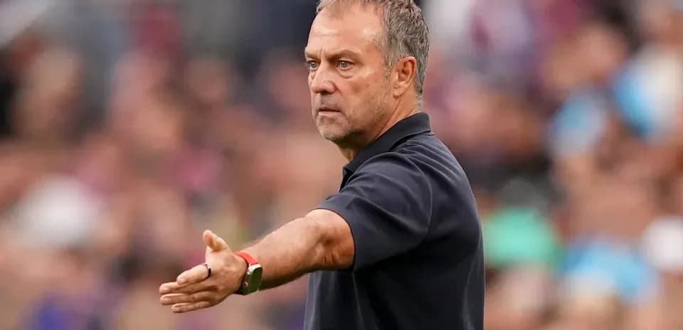 Coach gesturing during a football match