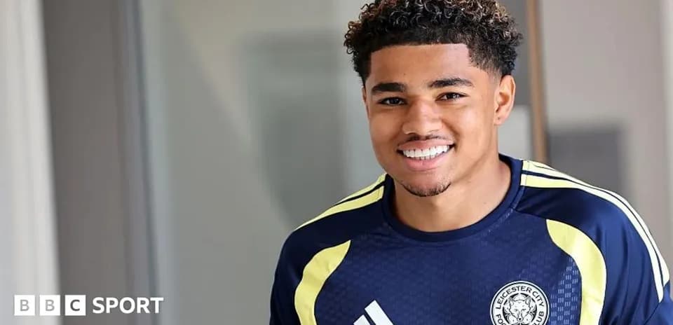 Football player smiling in Leicester City training kit