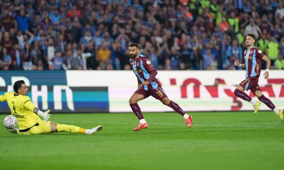 Player attempting to score against goalkeeper in match