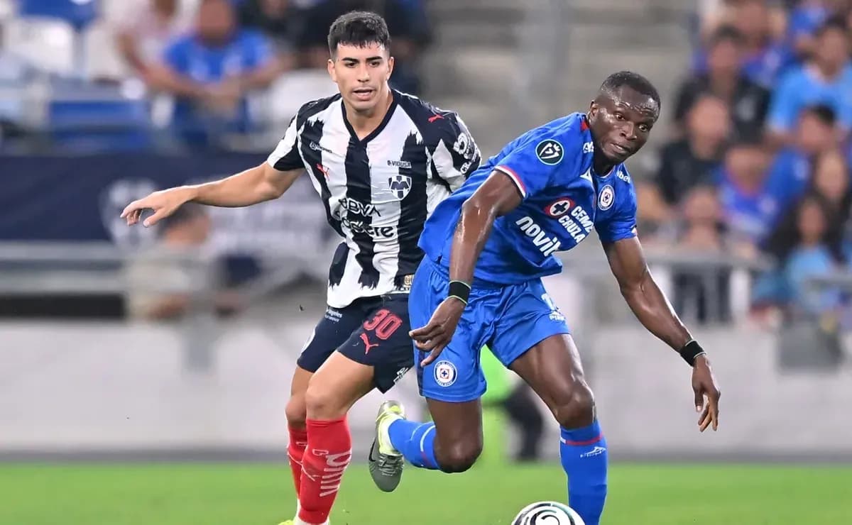 Monterrey player defending against Cruz Azul forward