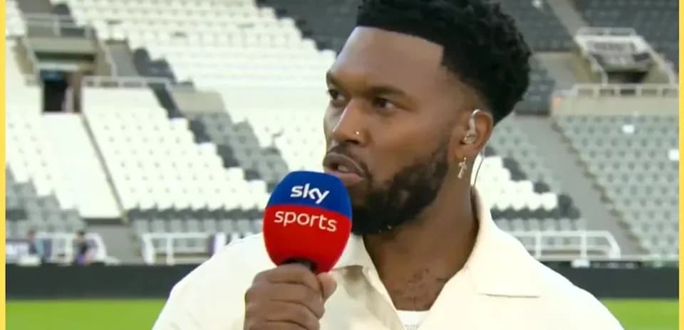 Presenter speaking into microphone during sports interview